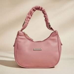 Lancaster Basic Chouchou baguette bag with a scrunchie-inspired handle in a rose antic (pink) color.
