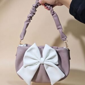 bow-shaped crossbody handbag.