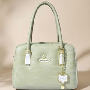 tote bag in a light color, possibly mint green or off-white.