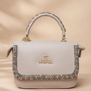 small grey top-handle satchel handbag in faux leather with a decorative trim.