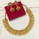 Title: Antique Gold Peacock & Elephant Motif Necklace Set with Kempu Stones