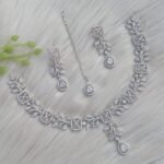 appears to be a silver-plated American diamond necklace set