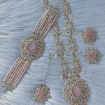 bridal jewelry set featuring a necklace, choker, earrings, and a maang tikka