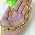 appears to be a traditional South Indian style gold-plated temple jewelry se