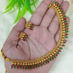 appears to be a traditional South Indian style gold-plated temple jewelry se