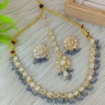 ndian-style antique Kundan jewellery set includes a necklace, earrings, and a maang tikka
