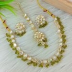 ndian-style antique Kundan jewellery set includes a necklace, earrings, and a maang tikka