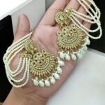 golden tana earrings featuring a multi-layered pearl chain design.