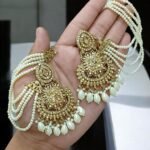 golden tana earrings featuring a multi-layered pearl chain design.