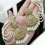 golden tana earrings featuring a multi-layered pearl chain design.