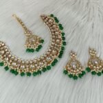 gold-plated Kundan and pearl maroon traditional choker necklace set