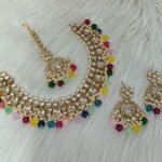 gold-plated Kundan and pearl maroon traditional choker necklace set