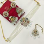 traditional necklace set is a Kundan and pearl choker jewelry set,