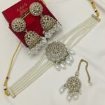 traditional necklace set is a Kundan and pearl choker jewelry set,
