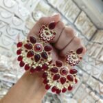 earrings are traditional Indian Kundan and pearl chandbali earrings