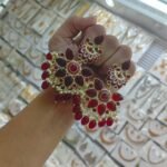 earrings are traditional Indian Kundan and pearl chandbali earrings