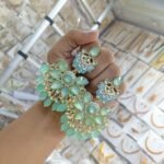 earrings are traditional Indian Kundan and pearl chandbali earrings