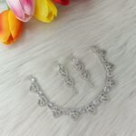 American Diamond or Cubic Zirconia studded necklace set featuring a silver-plated finish.