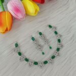 American Diamond or Cubic Zirconia studded necklace set featuring a silver-plated finish