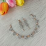 American Diamond or Cubic Zirconia studded necklace set featuring a silver-plated finish.