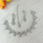 ewelry set is identified as a silver-plated American diamond necklace set