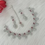 ewelry set is identified as a silver-plated American diamond necklace set