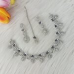 ewelry set is identified as a silver-plated American diamond necklace set