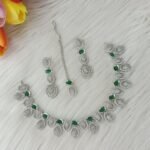 ewelry set is identified as a silver-plated American diamond necklace set