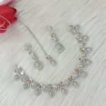 ewelry set is identified as a silver-plated American diamond necklace set