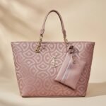 pink Saint Laurent monogram jacquard tote bag.