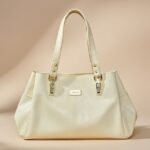 beige or off-white PU leather tote or shoulder bag.
