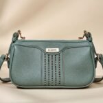 green faux leather women's sling or cross-body bag.