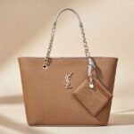 Saint Laurent Manon Mini raffia and leather shoulder bag in a natural color.