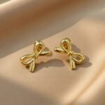 gold-plated bow stud earrings are available