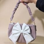 bow-shaped crossbody handbag.