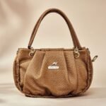 women's tan satchel handbag.