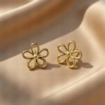 hollow-out gold-colored flower stud earrings,