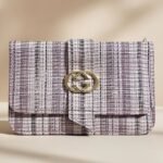 Gucci GG Marmont small shoulder bag in black matelassé leather.