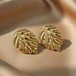 gold-plated leaf-shaped stud earrings are reminiscent
