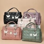 ladies' quilted top-handle bags with butterfly charms, available in black, pink, beige, and green colors.