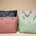 collection of faux crocodile embossed PU leather tote bags in black, pink, light pink, and mint green.