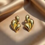 earrings are Sparkle Roniya Triple Drop Stud Earrings