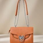 PU leather women's fashion crossbody bag in orange.