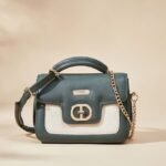 small, two-tone women's handbag, likely a crossbody or shoulder bag, but specific brand and material details are unknown due to a lack of useful search results.