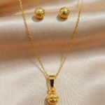 gold-plated chain necklace and matching stud earrings,