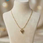 gold-toned heart pendant necklace,